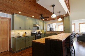 green-kitchen-island-family-room-south-falls-construction      